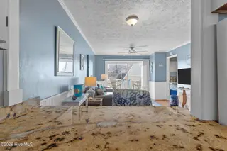 1000 Caswell Beach Road Apt. 806, Oak Island, NC 28465 — 2-bedroom condo in Oak Island Bch Villa, Oak Island, NC, photo 17 of 56: Open View to Dining/Living Area