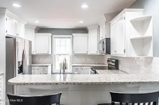 150 S Plum Street, Pinebluff, NC 28373 – photo 10: Kitchen with Stainless Steel Appliances