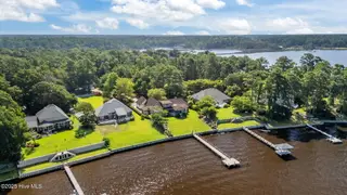 138 White Oak Bluff Road, Stella, NC 28582 – photo 2: 64-web-or-mls-DJI_20250725103228_0350_D