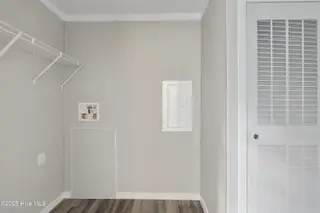 6777 Lewis Drive SE, Winnabow, NC 28479 – photo 22: Laundry room