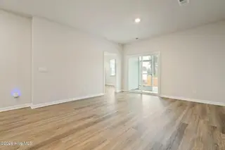 3583 Whaley Way NW, Ash, NC 28420 — 3-bedroom townhome in Brunswick Plantation, Ash, NC, photo 14 of 34: Living Room to Patio