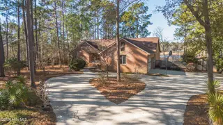 1461 S Shore Drive, Southport, NC 28461 – photo 2: front of house