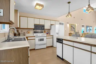 1708 W Beach Drive, Oak Island, NC 28465 – photo 14: 13-Final 1708 W Beach Dr OKI-RJREM-1838
