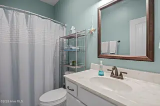 129 NW 11th Street, Oak Island, NC 28465 – photo 24: hall bath