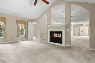76 Calabash Drive, Calabash, NC 28467 – photo 9: Carolina Room to bedroom 2 and LR