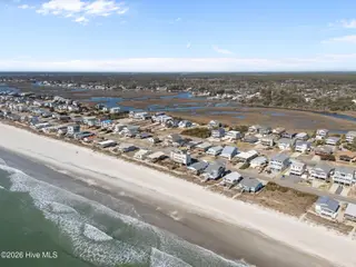 1025 W Beach Drive, Oak Island, NC 28465 – photo 3: 9-web-or-mls-DJI_20260122121949_0275_D