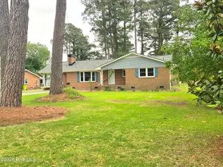 1018 Karen Drive, New Bern, NC 28562 – photo 24: 1018 Karen Front of house magnolia tree