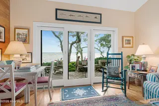 590 Westport Drive H1 Westport, Pine Knoll Shores, NC 28512 – photo 9: Living room with sound views
