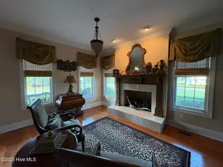25 Muirfield Drive, Whiteville, NC 28472 – photo 14: Gas logs, tile and brick fireplace
