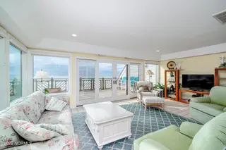 301 Salter Path Road 14 Genesis, Pine Knoll Shores, NC 28512 – photo 13: Light-filled living room w/ corner views
