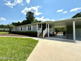 165 Hewett Burton Road SE, Leland, NC 28451 — 3-bedroom manufactured home in Sterling Oaks, Leland, NC, photo 1 of 32: 01-165 Hewett Burton Road SE