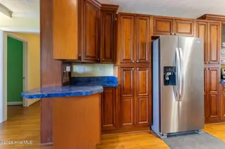 704 Canal Cove Road, Lake Waccamaw, NC 28450 – photo 19: Kitchen With Bar Seating