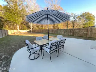 93 Shamrock Drive SW, Sunset Beach, NC 28468 – photo 2: Large Patio with fenced Private yard