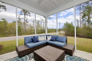 241 Eagle Claw Dr 4014, Carolina Shores, NC 28467 – photo 12: Compton - Screened Lanai