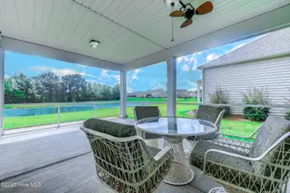 520 Slippery Rock Way, Calabash, NC 28467 — 3-bedroom home in The Farm, Calabash, NC, photo 24 of 33: Screened Porch Area