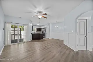 323 Cedar Island Trail, Holly Ridge, NC 28445 — 3-bedroom townhome in The Landing At Folkstone, Holly Ridge, NC, photo 8 of 36: 12_living room