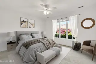 1009 N Sanderling Drive, Leland, NC 28451 — 3-bedroom townhome in Waterford of the Carolinas, Leland, NC, photo 19 of 63: Staged Primary Bedroom