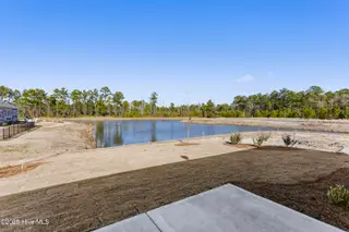 3462 Lake Club Circle, Oak Island, NC 28461 – photo 13: pond view