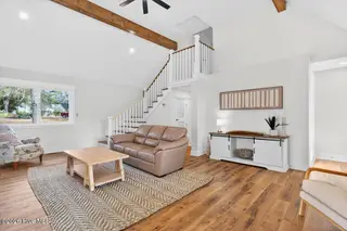 501 Shoreline Drive E, Sunset Beach, NC 28468 – photo 13: Bright tall ceilings and beams