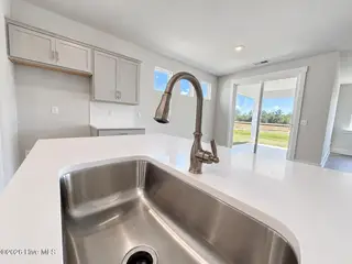 8615 Blue Haw Way Lot 125, Leland, NC 28451 — 3-bedroom home in Indigo Preserve, Leland, NC, photo 11 of 41: Quartz Countertops