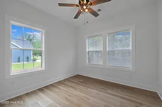82 Northeast Drive NW, Calabash, NC 28467 – photo 22: 82NE 3rd bedroom with ceiling fan