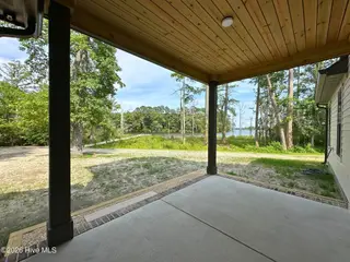 127 Pailin Creek Road, Elizabeth City, NC 27909 — 4-bedroom home in Pailin Creek Landing, Elizabeth City, NC, photo 15 of 59: Back Porch