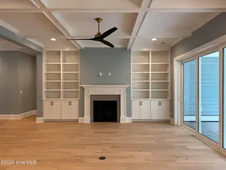 209 Coastal Dune Court, Wilmington, NC 28412 — 3-bedroom home in Riverlights, Wilmington, NC, photo 8 of 27: Brookshire Living Room with Built Ins