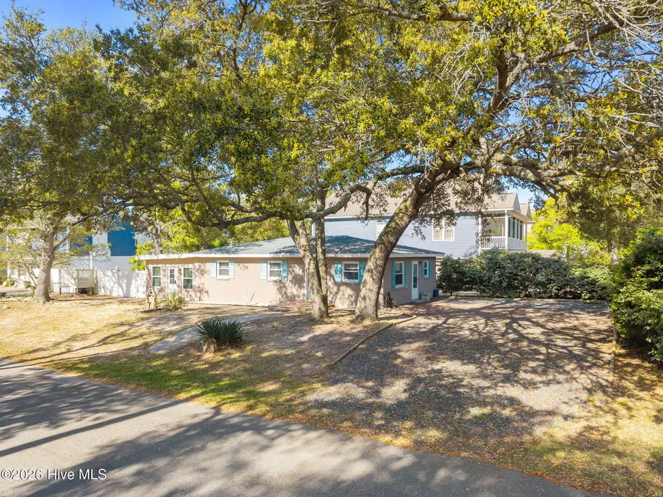 4107 E Oak Island Drive, Oak Island, NC 28465 – photo 1 of 44: 14-web-or-mls-DJI_20260416095637_0879_D