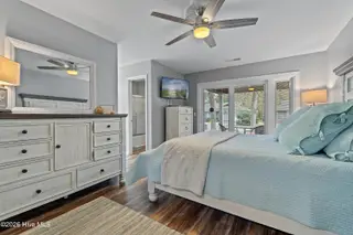 606 Camellia Lane, Sunset Beach, NC 28468 – photo 23: Primary bedroom