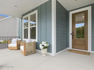 9251 Salty Breeze Place, Leland, NC 28451 — 5-bedroom home in Grand Park, Leland, NC, photo 5 of 42: Front Porch