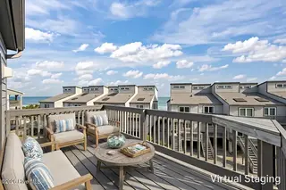 1928 New River Inlet Road 214, North Topsail Beach, NC 28460 – photo 17: Balcony Off Master Staged