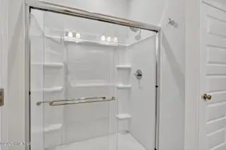 1206 Sunwater Terrace, Leland, NC 28451 — 3-bedroom townhome in Grand Park, Leland, NC, photo 16 of 48: Primary walk-in shower