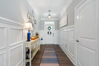 1353 Dunes Boulevard SW, Ocean Isle Beach, NC 28469 – photo 8: Gorgeous moldings throughout- Foyer
