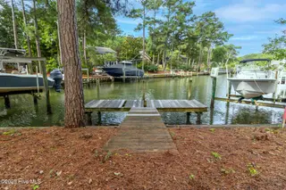 117 White Ash Drive, Pine Knoll Shores, NC 28512 – photo 24: Dock at end of canal