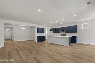 1731 Saucepan Bay Drive SW, Shallotte, NC 28470 – photo 10: Living & kitchen from casual dining