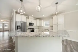 8983 Mango Bay Court NE, Leland, NC 28451 — 4-bedroom townhome in Compass Pointe, Leland, NC, photo 16 of 53: High Bar Seating