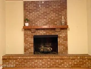 4641 Masonboro Loop Road, Wilmington, NC 28409 – photo 17: Fireplace in Family Room