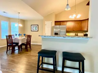 11 Court 11 Northwest Drive NW, Carolina Shores, NC 28467 — 3-bedroom home in Carolina Shores, Carolina Shores, NC, photo 7 of 28: 8-Kitchen, Bar area