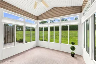 505 Village Green Drive A, Morehead City, NC 28557 – photo 24: Sunroom with powered blinds