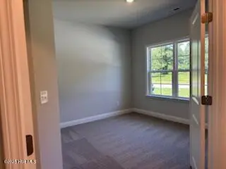 182 Cherry Laurel Drive, Wallace, NC 28466 – photo 6: Study or Bedroom with french doors