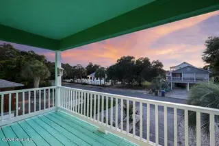 930 Tidewater Lane, Carolina Beach, NC 28428 – photo 3: Front Porch with Live Oaks