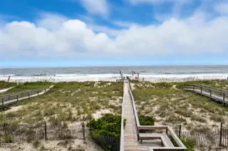 1106 Fort Fisher Boulevard N Unit 1, Kure Beach, NC 28449 – photo 6: 47 - Boardwalk to Beach