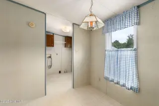 100 Lindsey Court, Beaufort, NC 28516 — 3-bedroom manufactured home in Green Meadows, Beaufort, NC, photo 23 of 38: Dining to Laudry and Back Entry