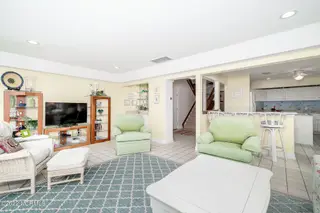 301 Salter Path Road 14 Genesis, Pine Knoll Shores, NC 28512 – photo 14: Light-filled living room w/ corner views