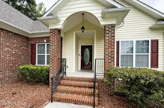 103 Castelnau Court, Jacksonville, NC 28540 — 5-bedroom home in Williamsburg Plantation, Jacksonville, NC, photo 2 of 52: 2. Front Porch