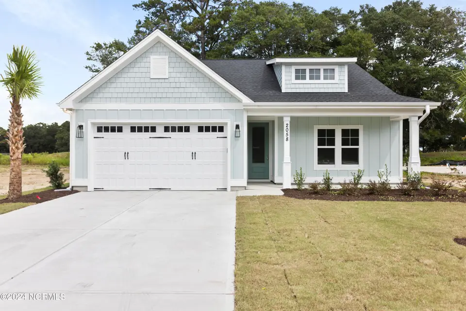 2058 Greenside Manor Drive SW, Ocean Isle Beach, NC 28469 – photo 1 of 53: 2058 Greenside Manor Drive