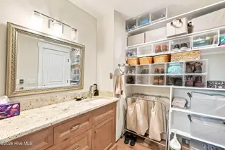 22 Pine Lake Drive, Whispering Pines, NC 28327 – photo 16: Primary Bathroom Suite with Storage