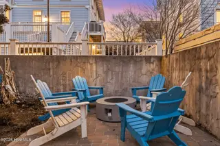 306 Coral Drive, Wrightsville Beach, NC 28480 — 5-bedroom home in Harbor Island, Wrightsville Beach, NC, photo 6 of 57: 003_backyard_twilight_740