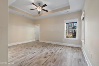123 Bellwood Circle, Sunset Beach, NC 28468 – photo 17: Primary bedroom