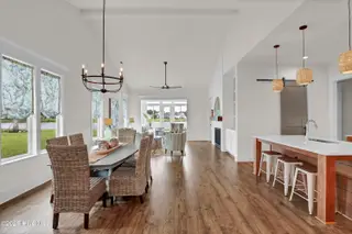 399 Summerhouse Drive, Holly Ridge, NC 28445 – photo 12: Dining area to kitchen and living area